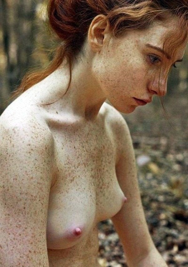 Redhead girl masturbates topless