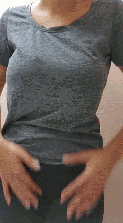 exposing her cute boobs from under t-shirt